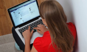 A girl using a MacBook
